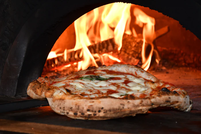 Pizza in a wood-fired oven